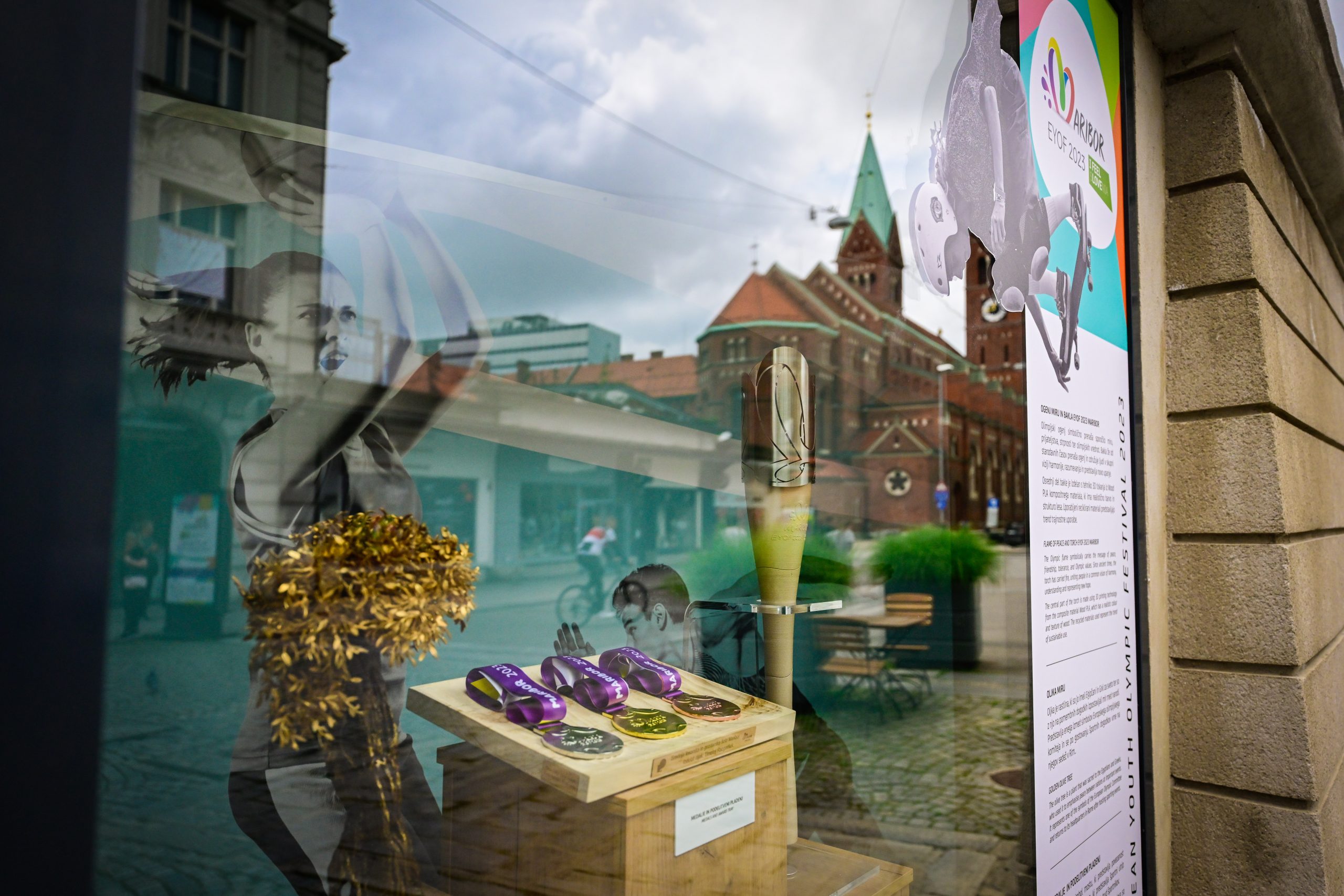 EYOF 2023 Maribor symbols in the Grajska kavarna window